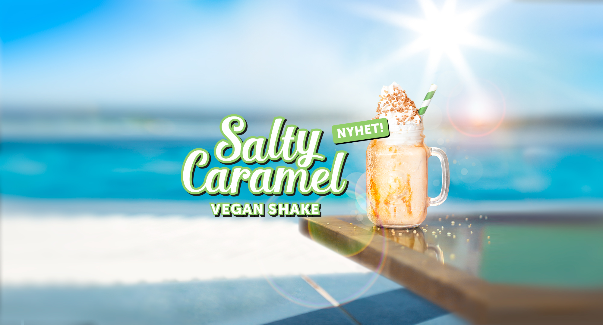 Vegansk shake från tacobar med en strand i bakgrunden