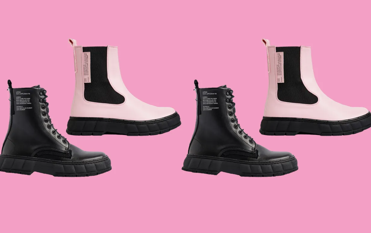 Uppradade kängor i svart och rosa mot en rosa bakgrund