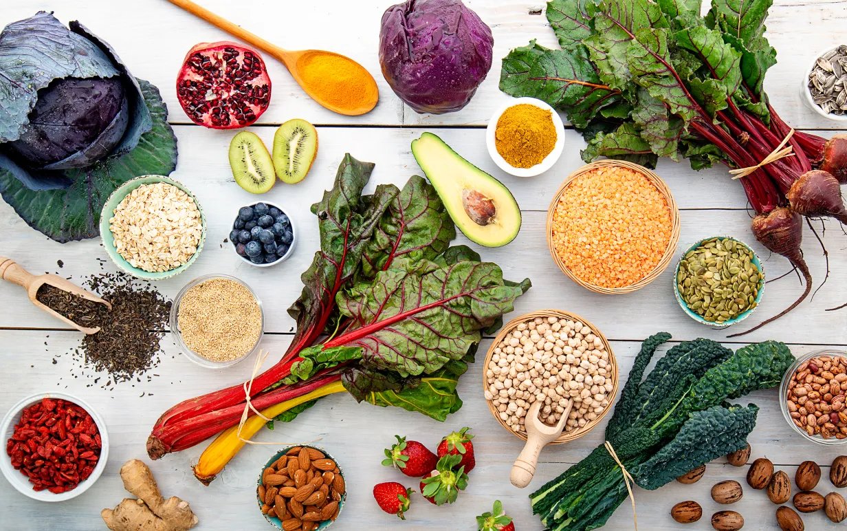 white wooden board with red vegetables cabbage turnips superfood