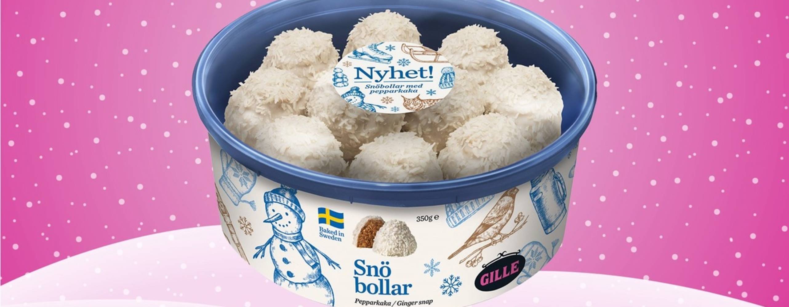 En burk med gillekakor mot en ljusrosa bakgrund med snö och snöflingor